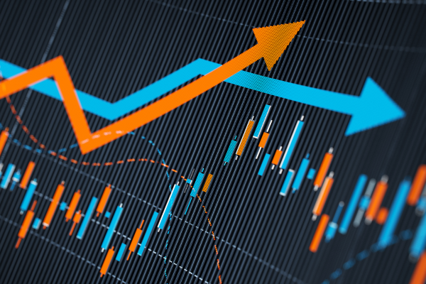 Blue and orange trending arrows on a digital graph