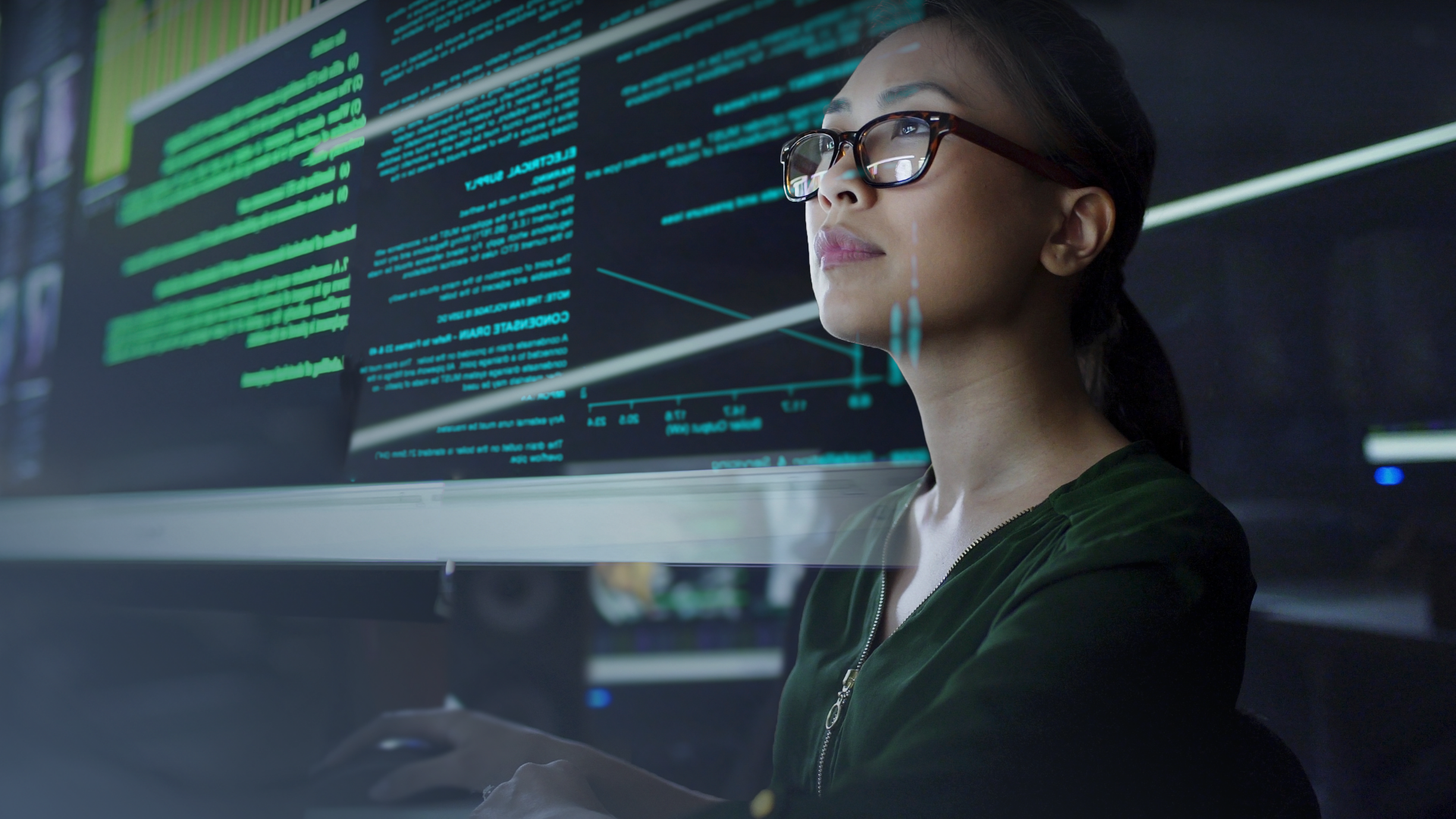 Female wearing glasses background screens with coding