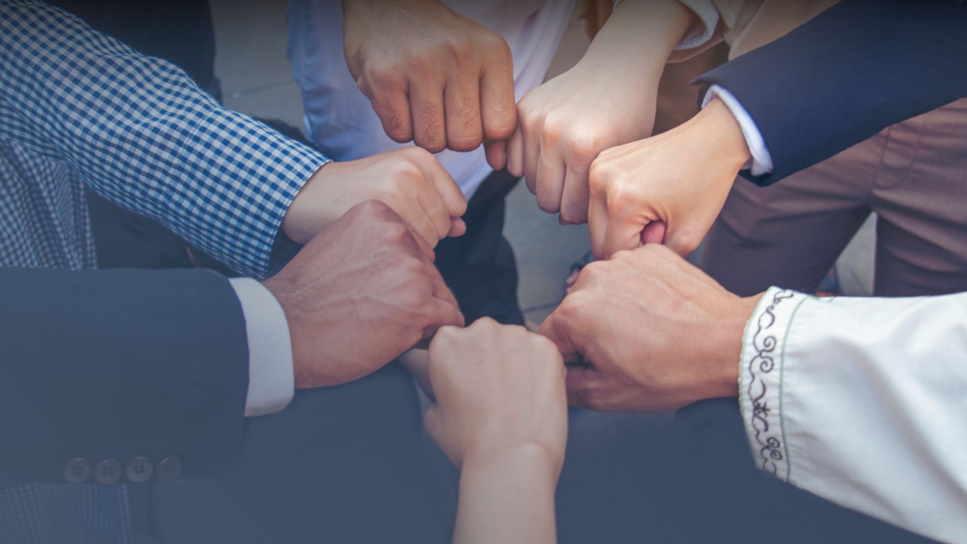 Colleagues in a huddle together
