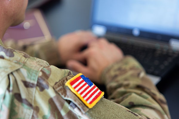 military arm with flag