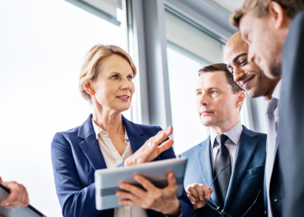 woman working with group on tablet