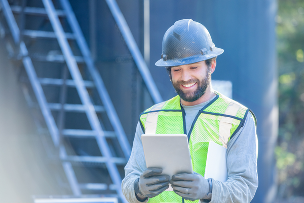 utility worker using tablet