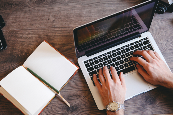 Typing on laptop