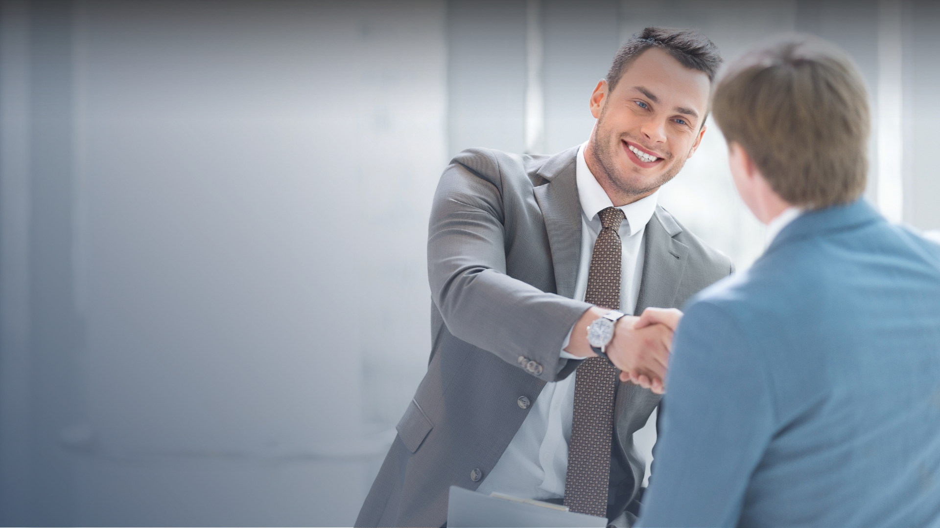 Smiling businessmen shaking hands