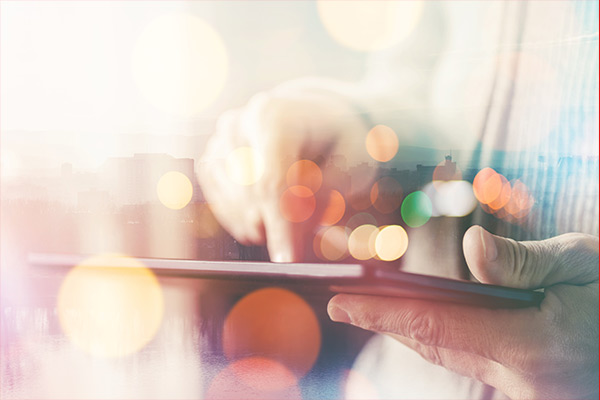 Hand on tablet