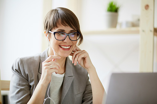 woman smiling at computer