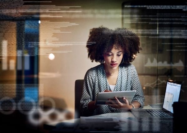 woman using tablet and computer