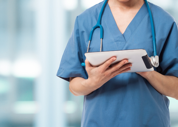 healthcare professional holding tablet