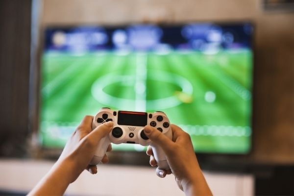 person using gaming console