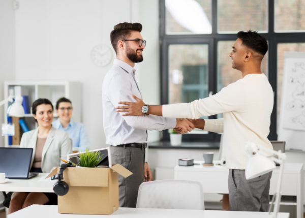 Young professionals shaking hands, new hire welcome to office