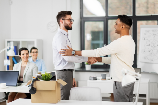 Young professionals shaking hands, new hire welcome to office