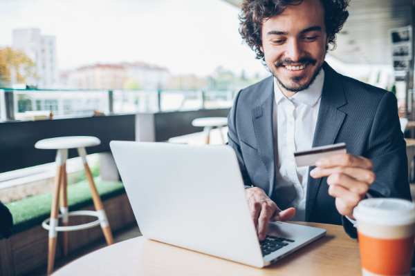 man making payment online with credit card