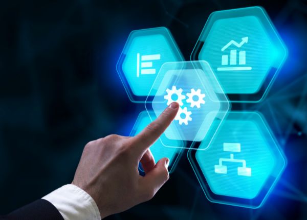 Hand pointing to digital image of gears