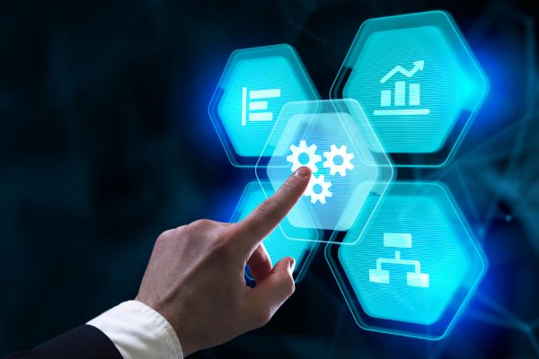 Hand pointing to digital image of gears
