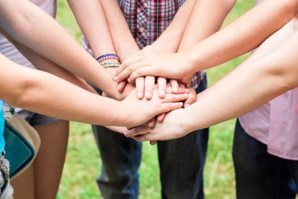 Group of teens with hands together