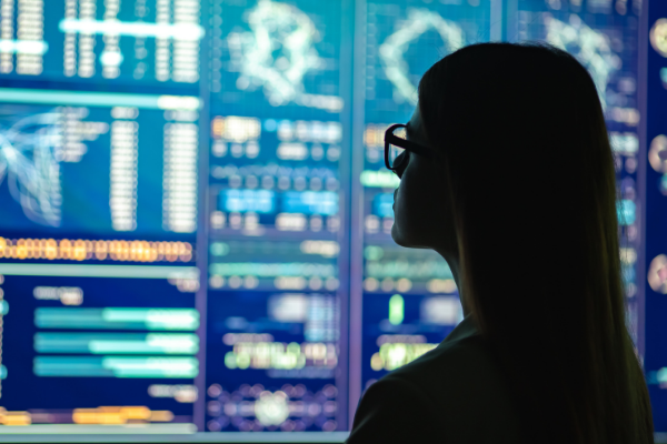 woman looking at analytics graphics