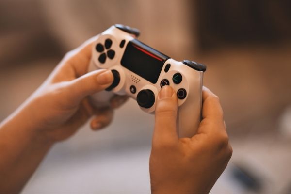 person using gaming console