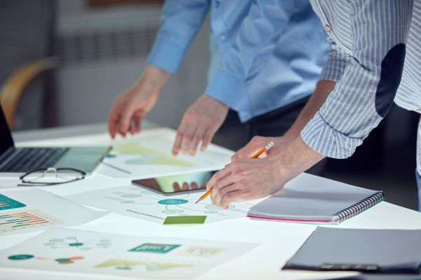 two men going through an array of documents
