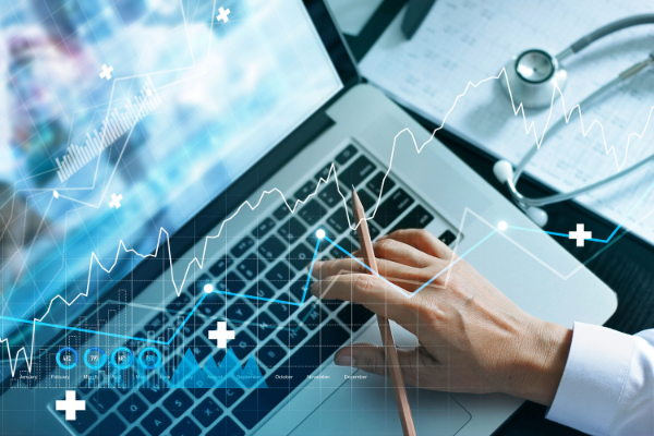 doctor operating laptop computer