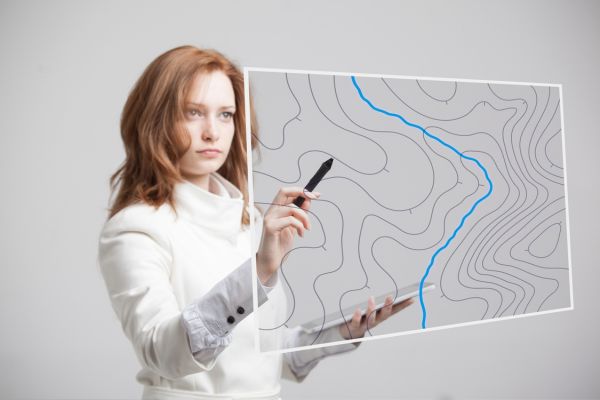 Professional woman mapping something digitally.