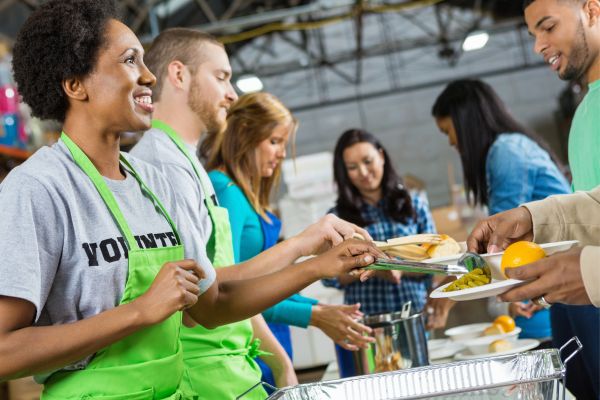 Volunteers feeding the homeless