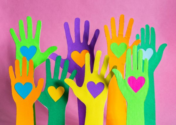 Colorful hands with hearts inside