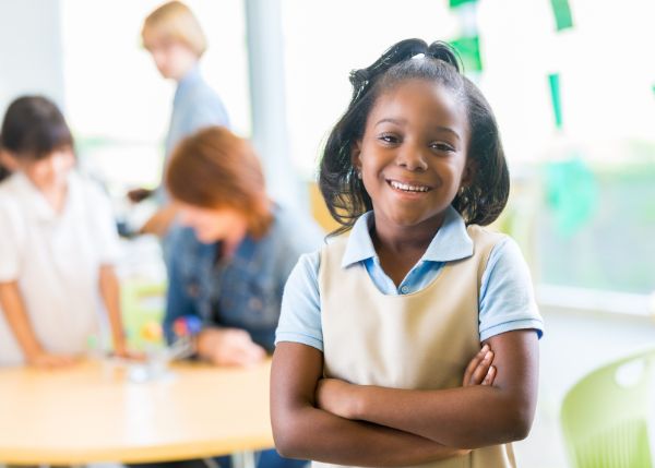 Girl in a private school uniform at school