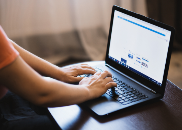 Hands on a computer searching