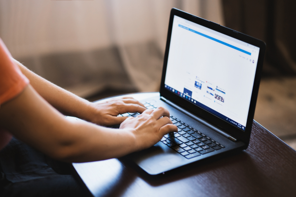 Hands on a computer searching