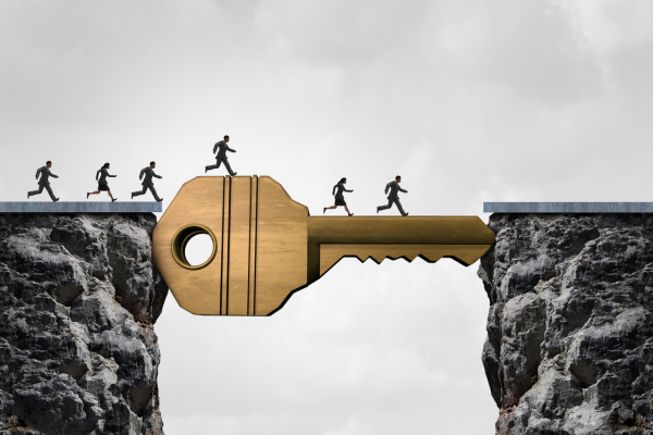 Business executives crossing a key