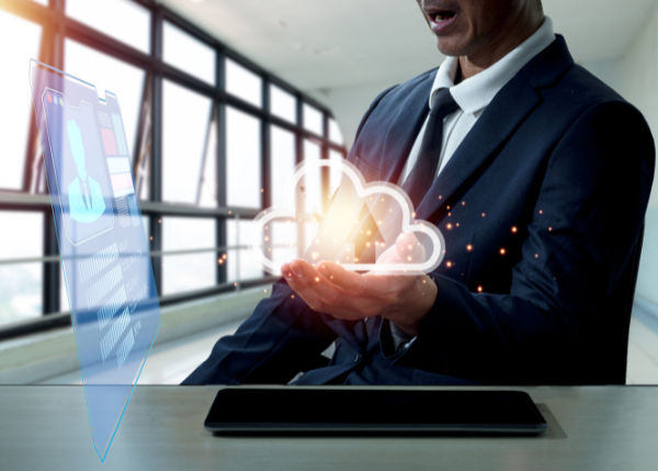 Businessman holding a cloud based technology