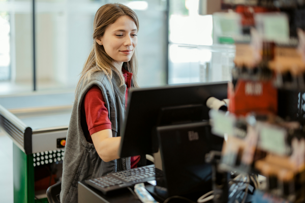 A woman working at a cash register. 
