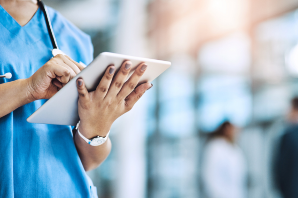 medical professional using tablet
