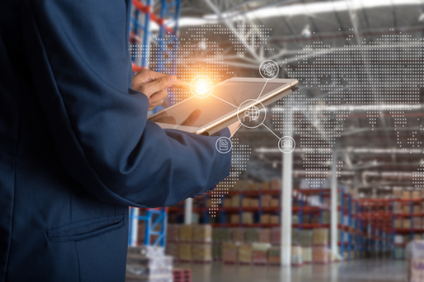 person using tablet in warehouse