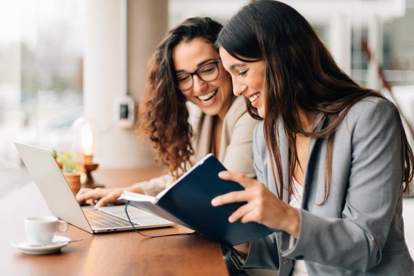 Two women collaborating at work