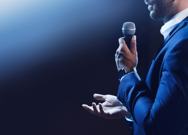 Man with microphone public speaking
