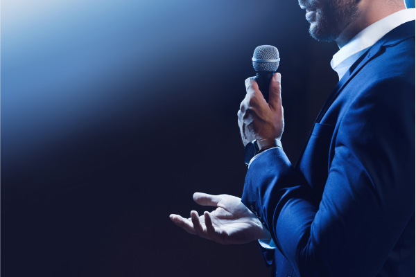 Man with microphone public speaking