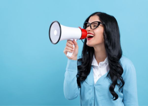 Woman shouting into a megaphone