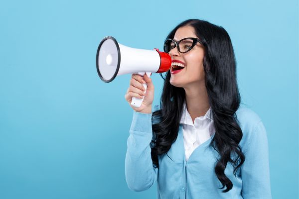 Woman shouting into a megaphone