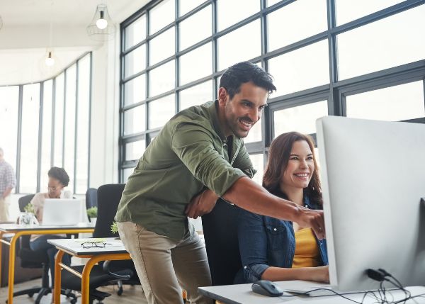 Man coaching an employee at work
